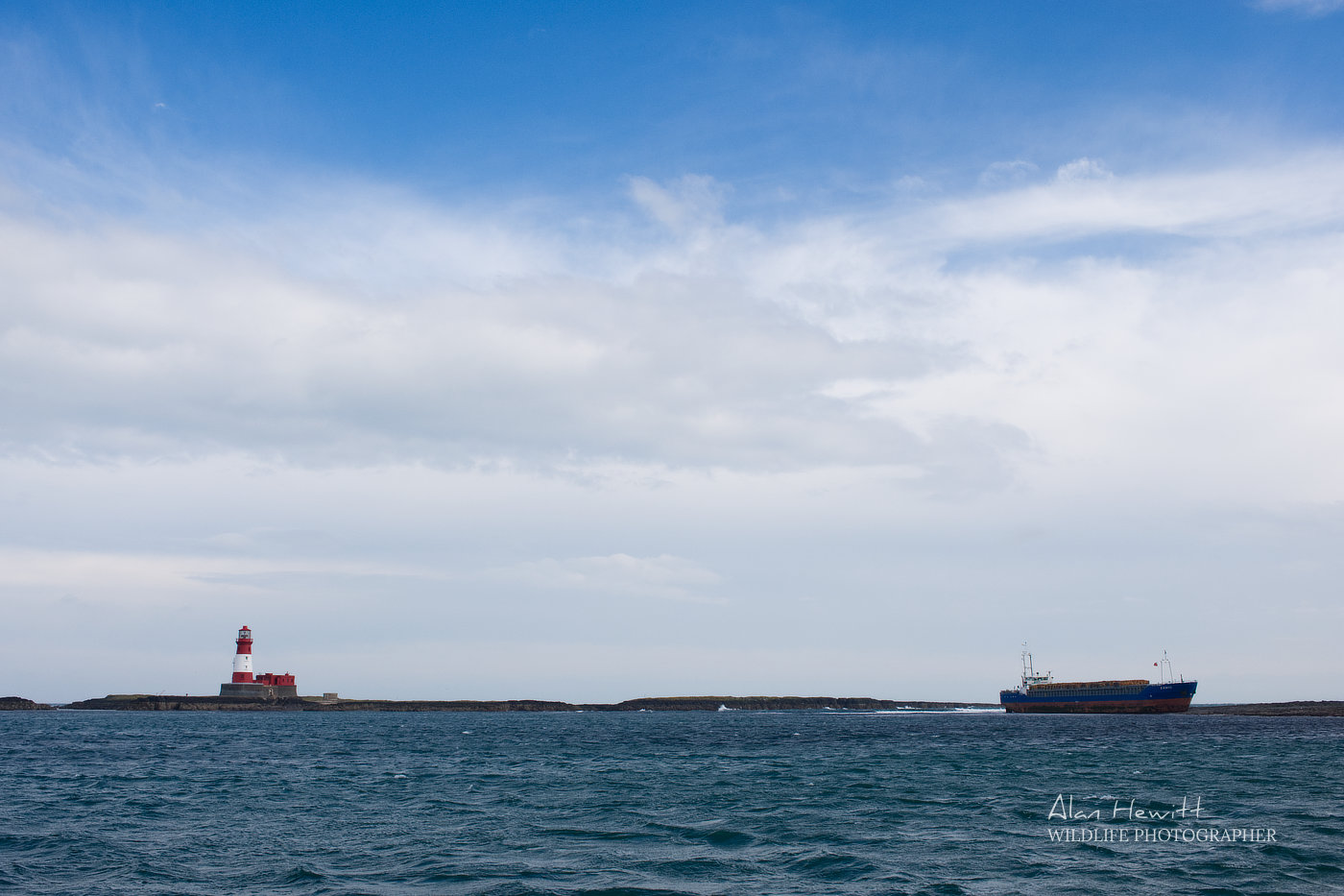 MV Danio Grounded on the Blue Caps with Longstone Lighthouse in proximity, Farne Islands. Alan Hewitt Photography.